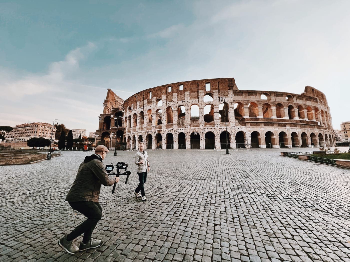 A camera operator filming at the Colosseum in Rome for Centuries Collide